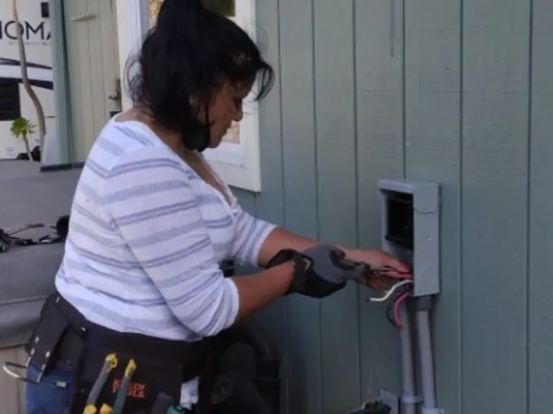 Licensed electrician wiring an exterior subpanel in Plattekill