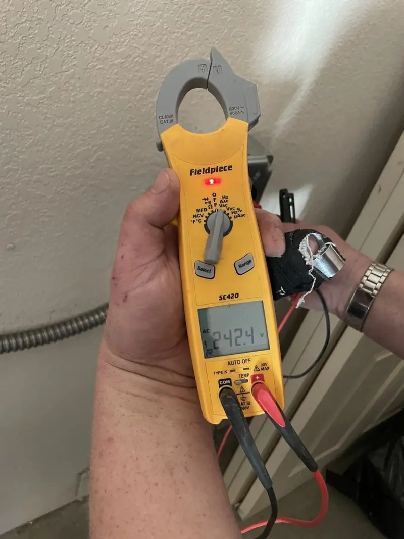 Voltage testing with clamp meter during Recessed Lighting Installation in Plattekill